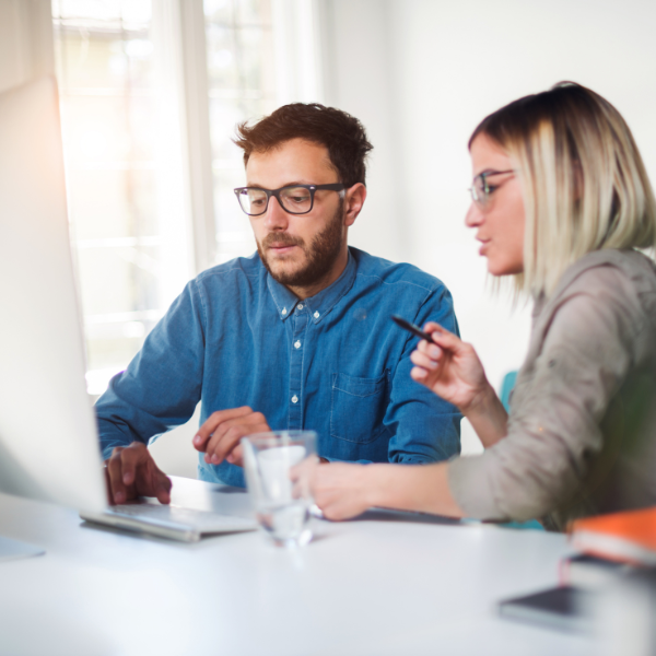 An image showing small business owners discussing health care sharing programs.